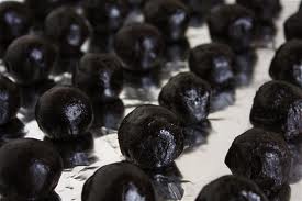 This is how they look without the melted chocolate on them, perfectly round and black.