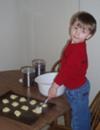 my son spooning batter onto cookie sheet